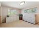 Well-lit bedroom features built-in storage and large windows, offering a functional and airy space at 1196 S Quebec Way, Denver, CO 80231