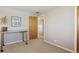 Bright room has a desk and hardwood door leading to another room, offering a functional and airy space at 1196 S Quebec Way, Denver, CO 80231