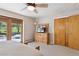 Serene bedroom includes outdoor access, closet, and dresser, providing a comfortable and organized retreat at 1196 S Quebec Way, Denver, CO 80231