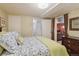 Cozy bedroom featuring neutral walls, soft bedding, and an ensuite laundry, offering comfort and convenience at 1196 S Quebec Way, Denver, CO 80231