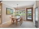 Bright dining area featuring a wood table and chairs and natural light at 1196 S Quebec Way, Denver, CO 80231