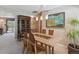Dining room featuring a wood table and chairs, modern art, and built in cabinetry at 1196 S Quebec Way, Denver, CO 80231