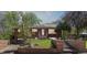 Charming brick home with a well-manicured lawn and inviting front entrance at 1196 S Quebec Way, Denver, CO 80231
