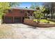 Brick home with an attached garage, a front yard, and a traditional design at 1196 S Quebec Way, Denver, CO 80231