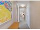 Inviting hallway features neutral tones and artwork, connecting the living spaces for easy navigation at 1196 S Quebec Way, Denver, CO 80231