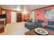 Basement living room with open shelving, eat in bar, and comfortable sofa at 1196 S Quebec Way, Denver, CO 80231