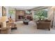 Inviting living room showcasing a stone fireplace, a view window, and comfortable seating at 1196 S Quebec Way, Denver, CO 80231