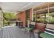 Backyard brick porch with outdoor furniture perfect for taking in the backyard scenery at 1196 S Quebec Way, Denver, CO 80231