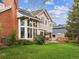 Beautifully landscaped backyard featuring a well-maintained lawn and a charming patio area at 3 Winged Foot Way, Littleton, CO 80123