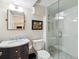 Bathroom featuring glass enclosed shower, stylish fixtures, and sleek design at 3 Winged Foot Way, Littleton, CO 80123