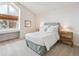 Bedroom featuring a large window, desk, and neutral decor at 3 Winged Foot Way, Littleton, CO 80123