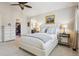 Bedroom with plush carpeting, walk-in closet, and access to an ensuite bathroom at 3 Winged Foot Way, Littleton, CO 80123
