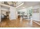 Open entryway flowing into a living room with hardwood floors and natural light at 3 Winged Foot Way, Littleton, CO 80123
