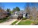 Charming two-story home with a well-manicured lawn, mature trees, and a two-car garage at 3 Winged Foot Way, Littleton, CO 80123