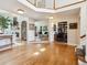 Open foyer with hardwood floors leads to living areas, showcasing a bright and inviting space at 3 Winged Foot Way, Littleton, CO 80123