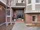 Elegant front door with decorative glass panels and a brick facade at 3 Winged Foot Way, Littleton, CO 80123