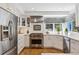 Bright white kitchen featuring stainless steel appliances and stylish countertops at 3 Winged Foot Way, Littleton, CO 80123