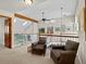 Second floor landing area with cozy chairs, views to the level below, and natural light from a window at 3 Winged Foot Way, Littleton, CO 80123