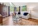Inviting living room features hardwood floors, large windows, and comfortable seating at 3 Winged Foot Way, Littleton, CO 80123