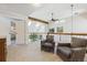 Inviting living room with vaulted ceilings, skylights, and comfortable armchairs at 3 Winged Foot Way, Littleton, CO 80123