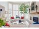 Light-filled living room with a fireplace, large windows, and comfortable seating at 3 Winged Foot Way, Littleton, CO 80123