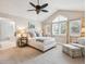 Bright main bedroom with vaulted ceiling, multiple windows, plush carpet, and a luxurious en suite bathroom at 3 Winged Foot Way, Littleton, CO 80123