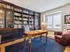 Home office with built-in bookshelves, cozy seating, and a window seat at 3 Winged Foot Way, Littleton, CO 80123