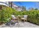 Cozy patio seating area surrounded by lush greenery, perfect for outdoor relaxation at 3 Winged Foot Way, Littleton, CO 80123
