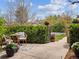 Charming outdoor patio area with mature plantings, offering privacy and tranquility at 3 Winged Foot Way, Littleton, CO 80123
