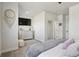 Bright bedroom with a large dresser, television, and a cozy bed, perfect for relaxation at 2862 E 103Rd Ave, Denver, CO 80229