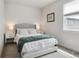 Serene bedroom with a tufted headboard, side tables, and a cozy duvet at 2862 E 103Rd Ave, Denver, CO 80229