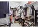 Spacious walk-in closet featuring ample shelving and hanging space for organized storage at 2862 E 103Rd Ave, Denver, CO 80229