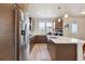 Spacious kitchen with stainless steel appliances, large island, and modern cabinetry at 2862 E 103Rd Ave, Denver, CO 80229
