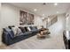 Relaxing living room with a large sectional sofa and stylish decor at 2862 E 103Rd Ave, Denver, CO 80229