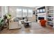 Spacious living room with a modern fireplace, stylish decor, and plenty of natural light at 2862 E 103Rd Ave, Denver, CO 80229
