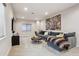 Comfortable living room with a soft couch, ottoman, and carpeted floor at 2862 E 103Rd Ave, Denver, CO 80229