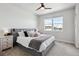 Inviting main bedroom with plush bedding, side tables, and natural light from windows at 2862 E 103Rd Ave, Denver, CO 80229