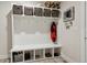 Well-organized mudroom with storage baskets and hooks for coats and bags at 2862 E 103Rd Ave, Denver, CO 80229
