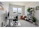 Bright home office with a desk, chair, and bookshelf for a productive workspace at 2862 E 103Rd Ave, Denver, CO 80229