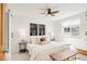 Calm bedroom showcasing a comfy bed, modern black and white art, and a ceiling fan for a serene and stylish retreat at 155 S Pennsylvania St # 205, Denver, CO 80209