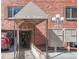 Apartment entrance featuring a covered walkway and mailboxes at 155 S Pennsylvania St # 205, Denver, CO 80209