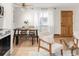 Contemporary living area with a dining table, decorative window, and modern finishes at 155 S Pennsylvania St # 205, Denver, CO 80209