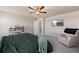 Tranquil bedroom with a king-size bed, a comfortable chair and neutral color scheme at 244 Chipeta Way, Lochbuie, CO 80603
