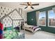 Bright bedroom featuring a themed bed frame and an exterior view at 244 Chipeta Way, Lochbuie, CO 80603