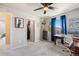 Sunlit bedroom featuring a desk and a walk-in closet with ample storage at 244 Chipeta Way, Lochbuie, CO 80603