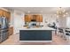 Beautiful kitchen featuring stainless steel appliances, ample counter space and a breakfast bar at 244 Chipeta Way, Lochbuie, CO 80603
