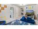 Fun playroom with space-themed carpet, comfortable seating and plenty of space for toys and activities at 244 Chipeta Way, Lochbuie, CO 80603