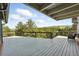 Back deck overlooking a field with many tall pine trees surrounding the property at 31 Wild Tiger Ln, Boulder, CO 80302