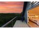 Scenic balcony with a chair overlooking mountain views and a peek into the bedroom at 31 Wild Tiger Ln, Boulder, CO 80302