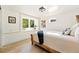 Charming bedroom with a unique wooden bed frame, neutral decor, and natural light at 31 Wild Tiger Ln, Boulder, CO 80302